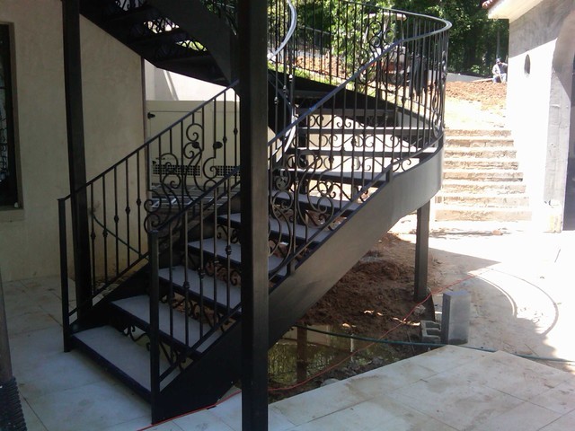 Outdoor cast wrought iron spiral staircase